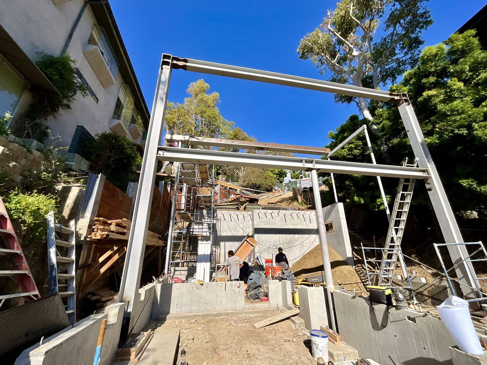 Steel portal frame with wide flange beams going up on the Alta Vista hillside site