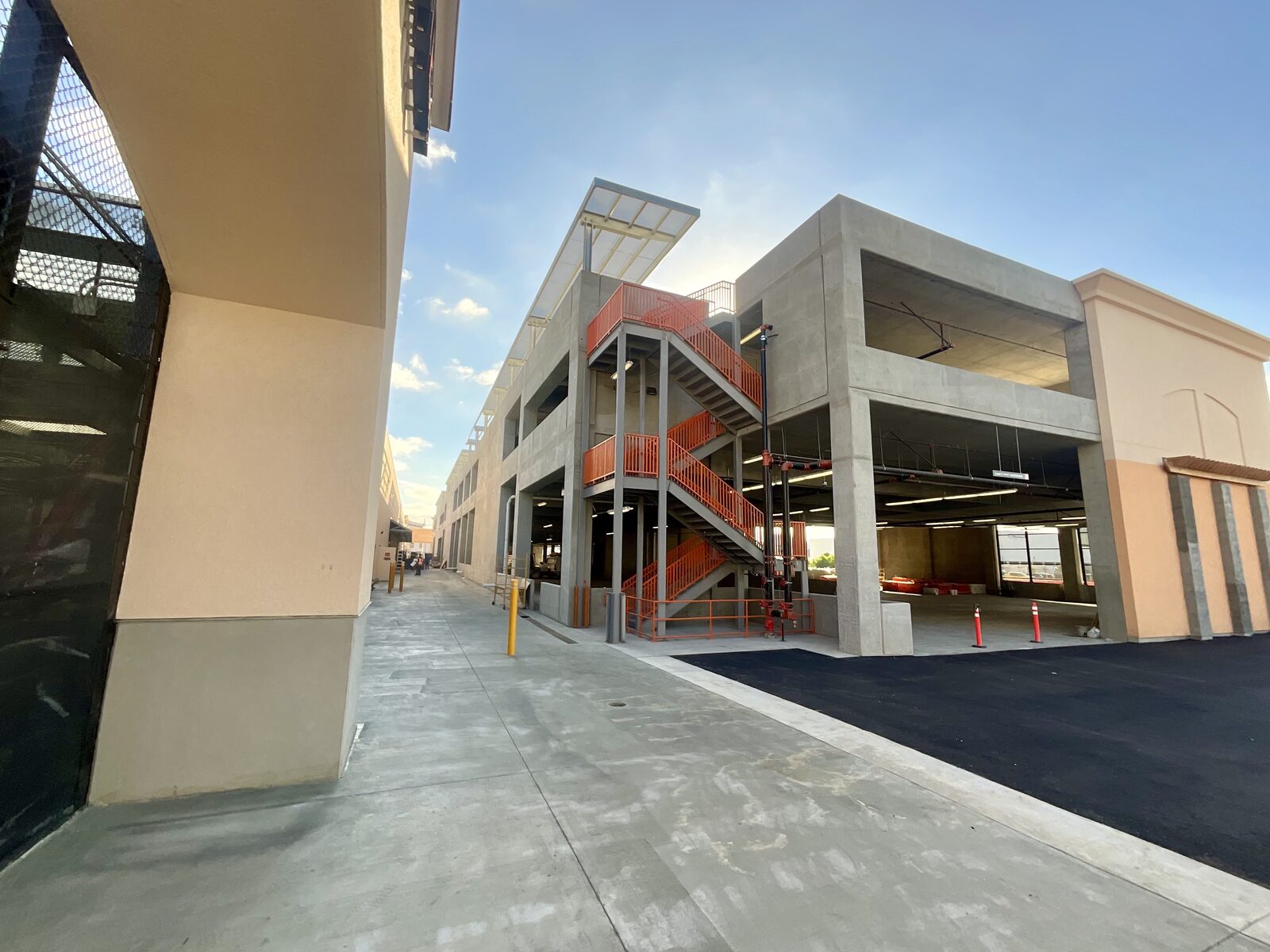 Finished orange steel stairs and handrails at the Home Depot Mission Valley project