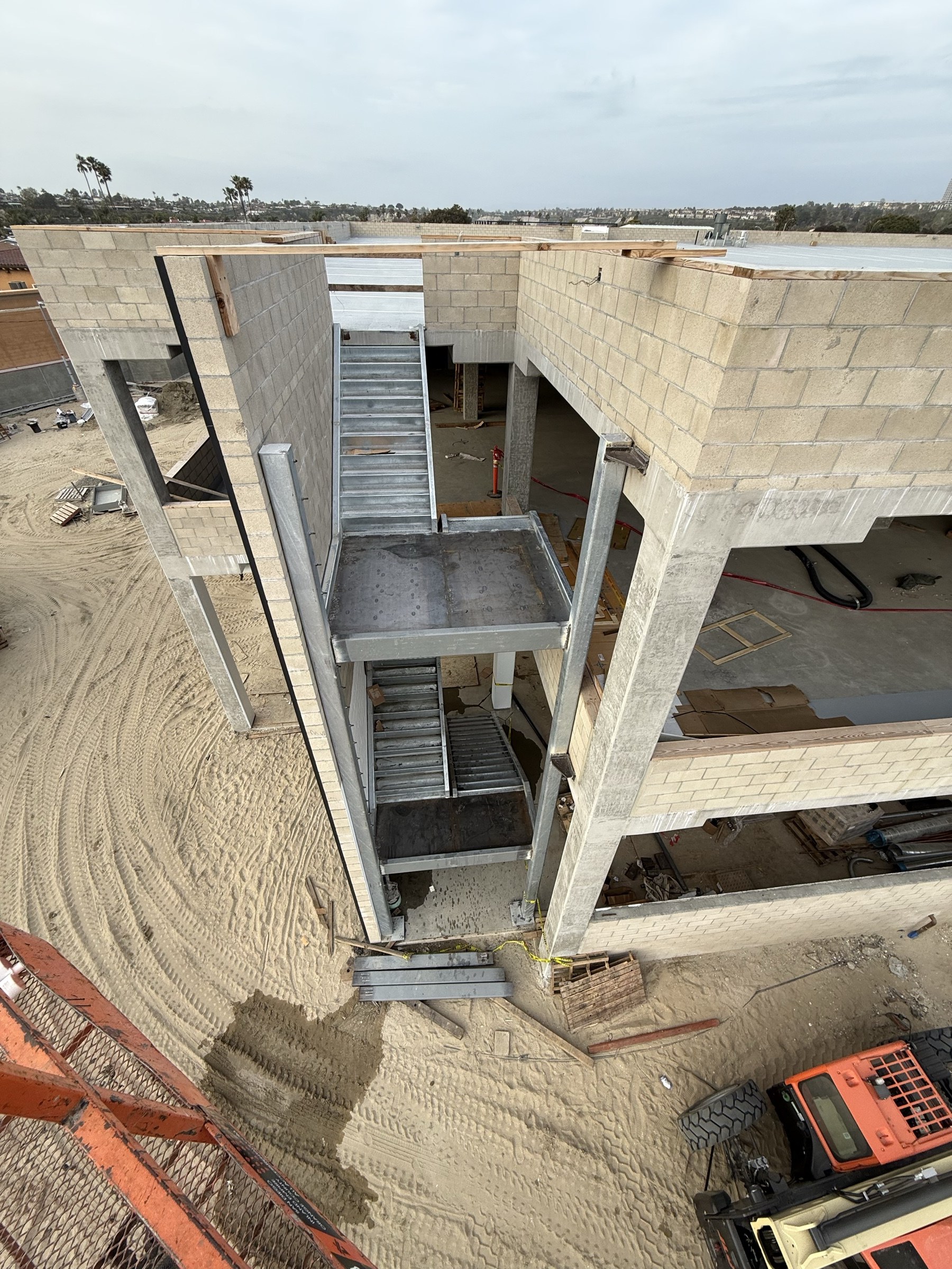 Porsche Dealership stair steel and CMU walls
